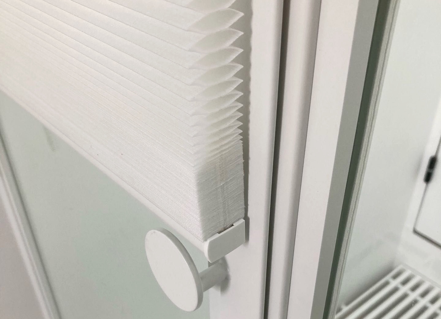 Store plissé toile blanche